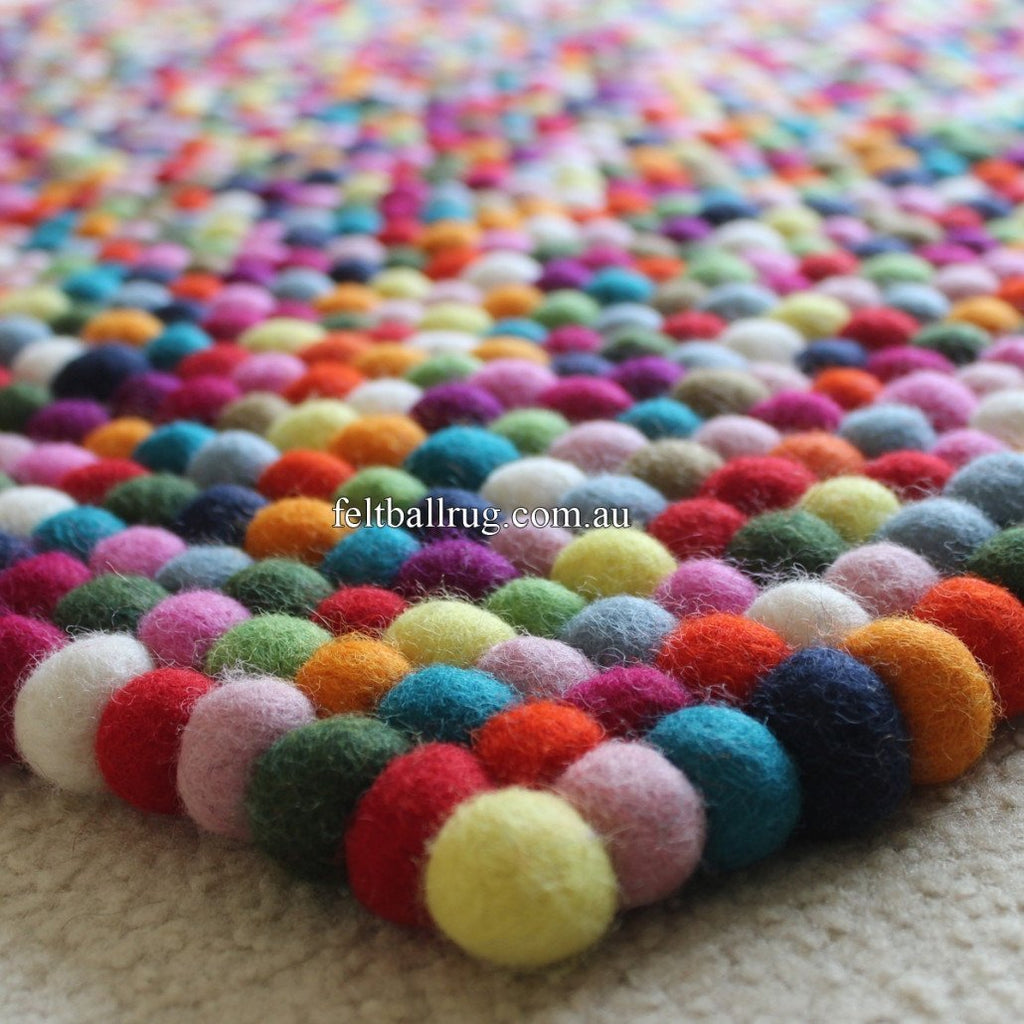http://feltballrugusa.com/cdn/shop/products/multicolor-square-felt-ball-rug2-1030x1030_1024x.jpg?v=1599177478